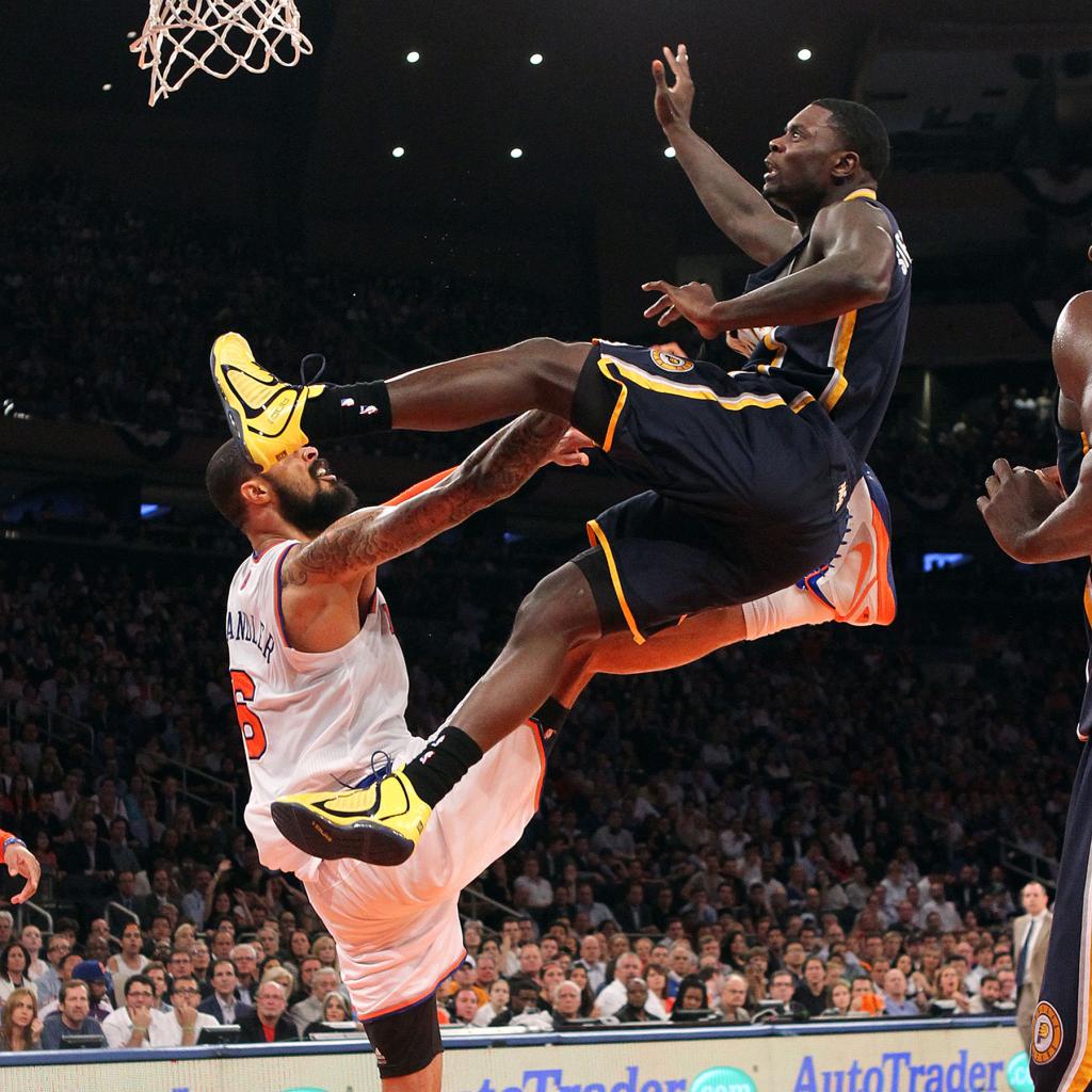 New York Knicks center Tyson Chandler #6 defends as Indiana Pacers shooting guard Lance Stephenson #1 takes a shot in the 1st half