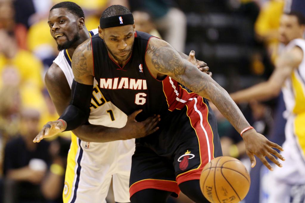 Miami Heat forward LeBron James (6) loses control of the ball as Indiana Pacers guard Lance Stephenson (1) defends during the third quarter in game five of the Eastern Conference Finals of the 2014 NBA Playoffs at Bankers Life Fieldhouse.