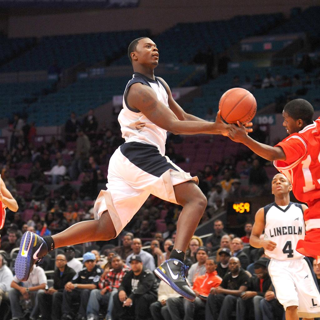 Lincoln's Lance Stephenson glides towards the basket attempting an underhand layup as JFK Naquan Pierce covers him in the third quarter as Lincoln played JFK in the BOYS PSAL championship final at Madison Square Garden on Saturday, March 21, 2009.