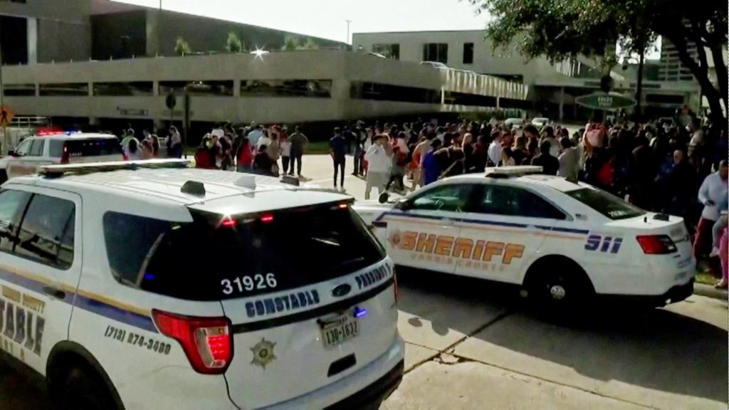 Law enforcement vehicles are parked outside the evacuated Lakewood Church of television evangelist Joel Osteen after a shooting incident in Houston.