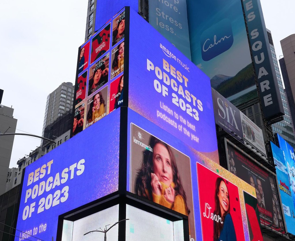 Lemonada Media's "Wiser Than Me," hosted by Julia Louis-Dreyfus, was named one of Amazon's Best Podcasts of 2023. This is in Times Square.