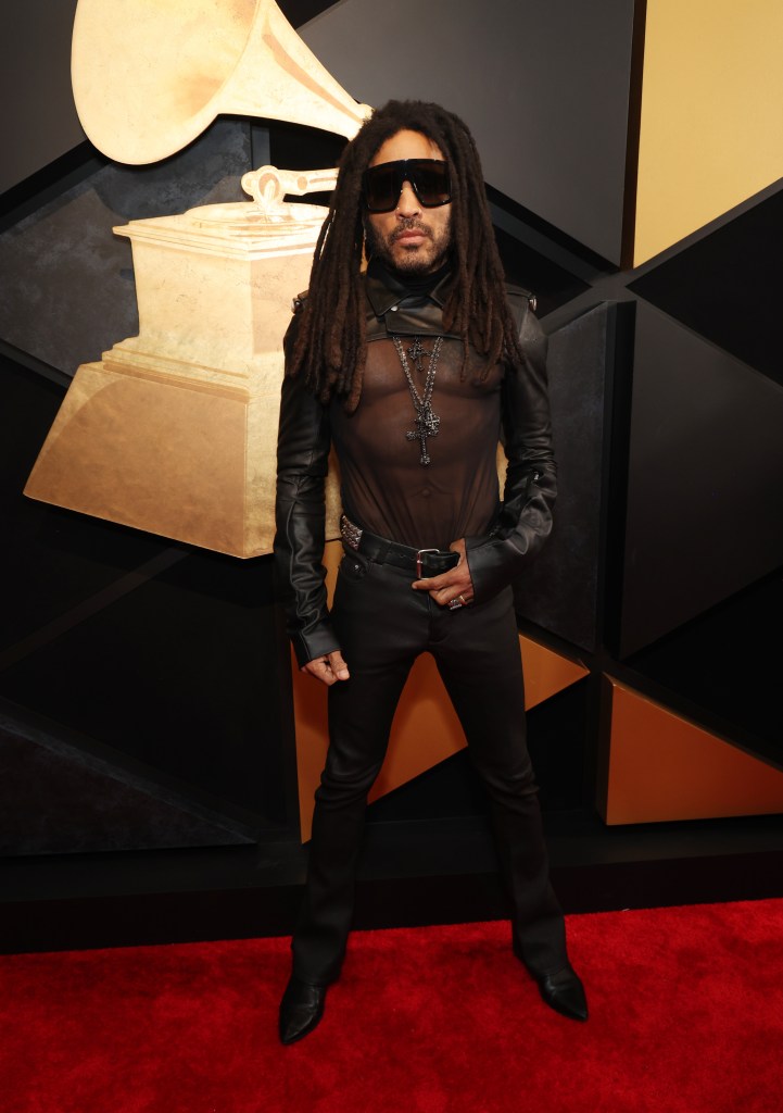 Lenny Kravitz wearing sunglasses and a leather jacket at the 66th GRAMMY Awards.