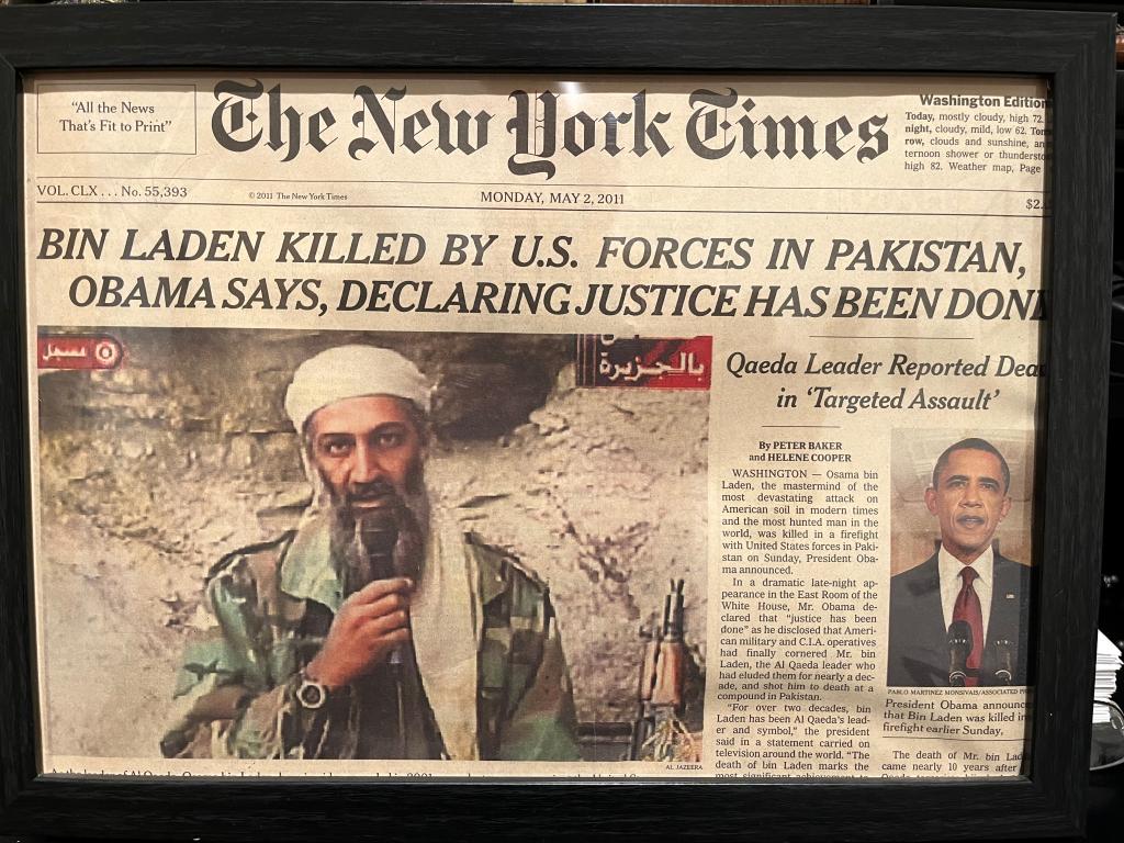 New York Times front cover from May 2, 2011, reporting on the death of Osama Bin Laden. Bin Laden and Barack Obama are pictured. 