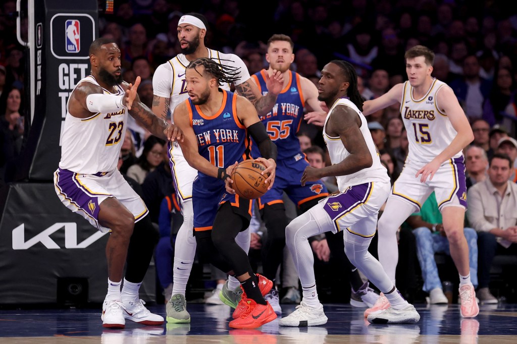 Jalen Brunson is trapped by Taurean Prince (12), Anthony Davis (3) and LeBron James (23) during the Knicks' loss to the Lakers on Feb. 3, 2024. 