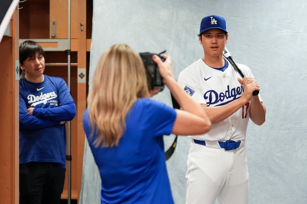 Dodgers Shohei Ohtani poses for a portrait during a spring training baseball team photo day