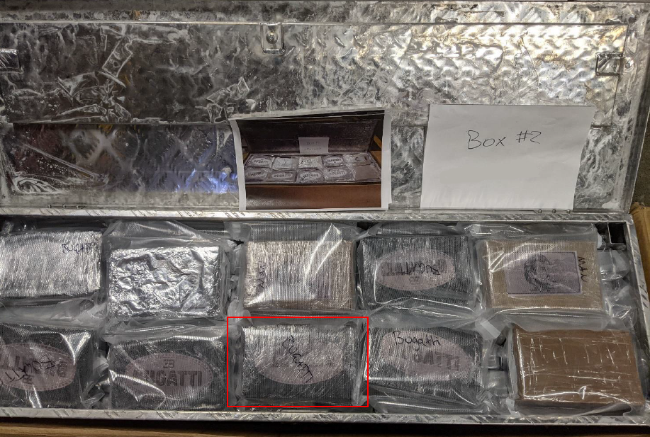 A photo of some of the cash and fake gold bullion bars found in the couple's flat.