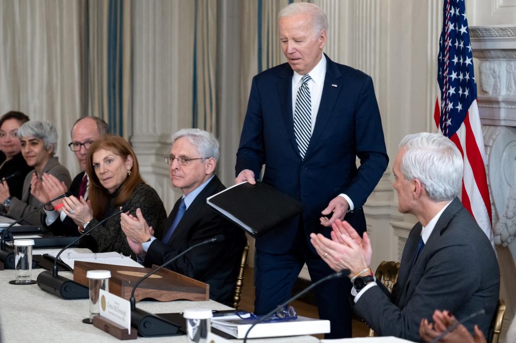 President Joe Biden sits with Attorney General Merrick Garland at a meeting of the Task Force on Reproductive Healthcare Access in the State Dining Room.
