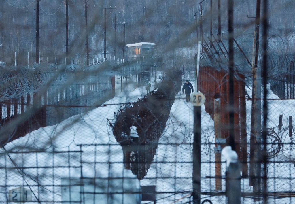 A member of the Federal Penitentiary Service walks at the IK-3 penal colony, where Russian opposition politician Alexei Navalny serves his jail term, in the settlement of Kharp in the Yamal-Nenets Region, Russia 