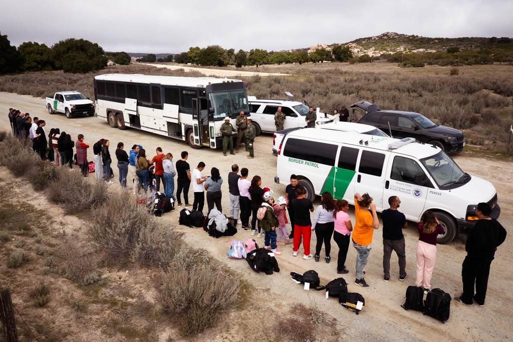 Migrants are processed by U.S. Customs and Border Protection officers after they crossed ithe U.S.-Mexico border on Tuesday, Feb. 20, 2024.