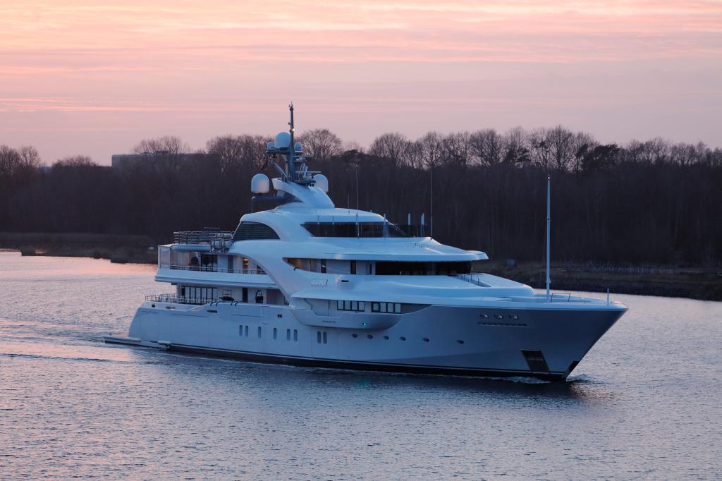 A white motoryacht on the Nord-Ostsee-Kanal after refurbishment at Blohm & Voss shipyard in Hamburg.