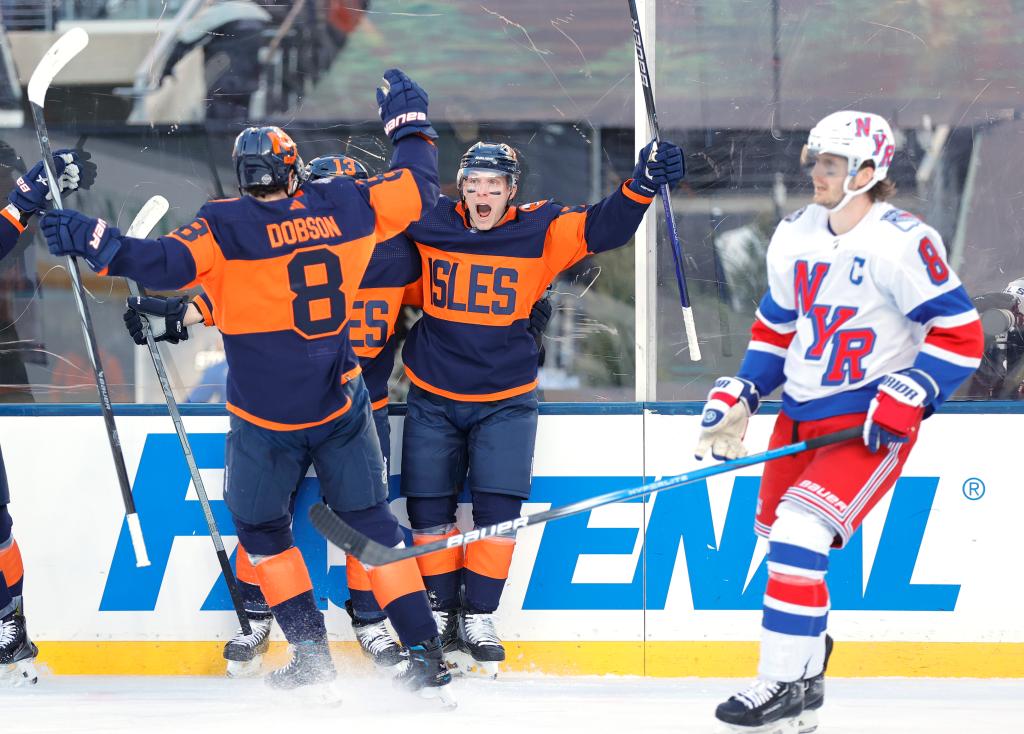 slanders Bo Horvat celebrates with his teammates after scoring a goal during the first period of their Stadium Series game at MetLife Stadium.