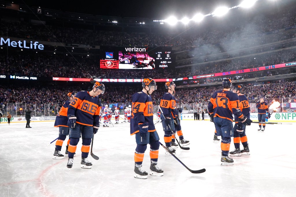 The Islander stake off the ice after their overtime loss to the Rangers on Sunday.