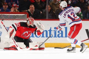 Alexis Lafreniere scored one of his two goals on Nico Daws during the Rangers' 5-1 win over the Devils.