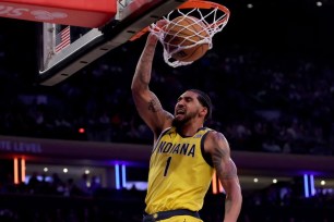 Former Knick Obi Toppin, who scored 12 points, slams home a dunk during the Pacers' 109-105 loss.