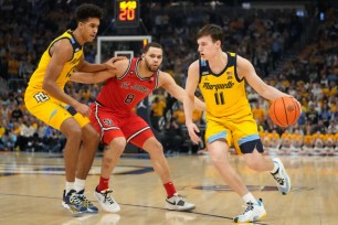 Marquette star guard Tyler Kolek, who scored 27 points and had 13 assists, looks to drive to the basket during St. John's 86-75 loss.