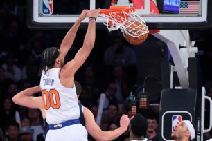 Jacob Toppin's slams home a dunk for his first two career NBA points during the Knicks' 122-108 loss to the Mavericks.