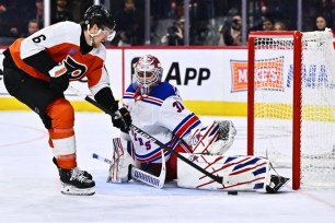 Igor Shesterkin saves a breakaway shot attempt from Travis Sanheim during the Rangers' 2-1 win over the Flyers.