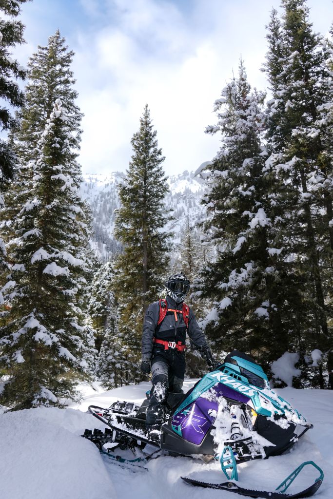 Zak, 23, is pictured on his snowmobile before buried alive for 7 minutes