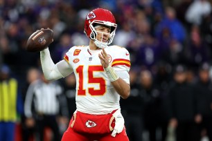 Patrick Mahomes looks to make a throw during the Chiefs' AFC Championship win over the Ravens on Jan. 28, 2024. 