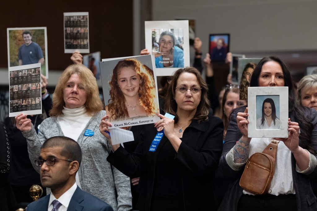 Mothers of teen social media victims hold up pictures of their children at a recent Senate hearing.