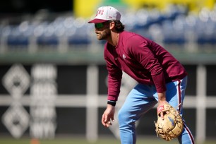 Phillies' Bryce Harper works out at first base before a baseball game against the Colorado Rockies, Thursday, April 20, 2023.