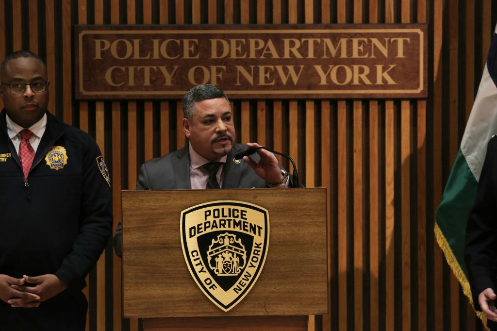 NYPD commissioner caban speaking at an nypd podium