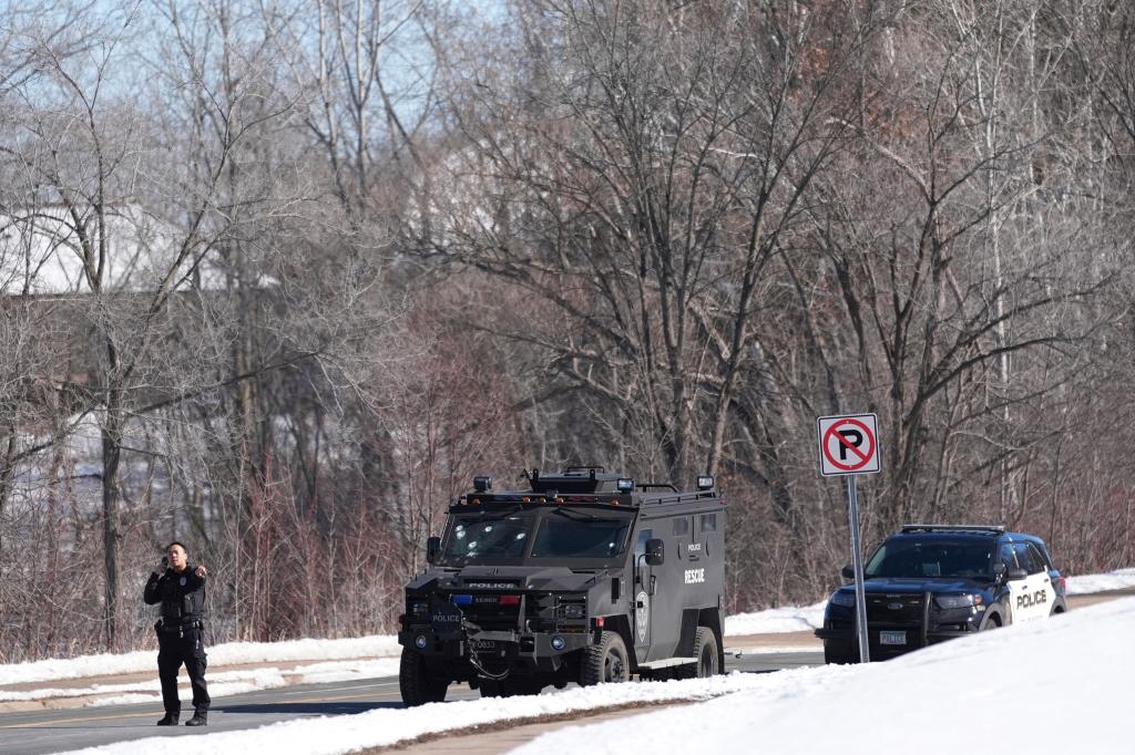 An armored police vehicle with a bullet-ridden windshield which responded to the shootout Sunday morning