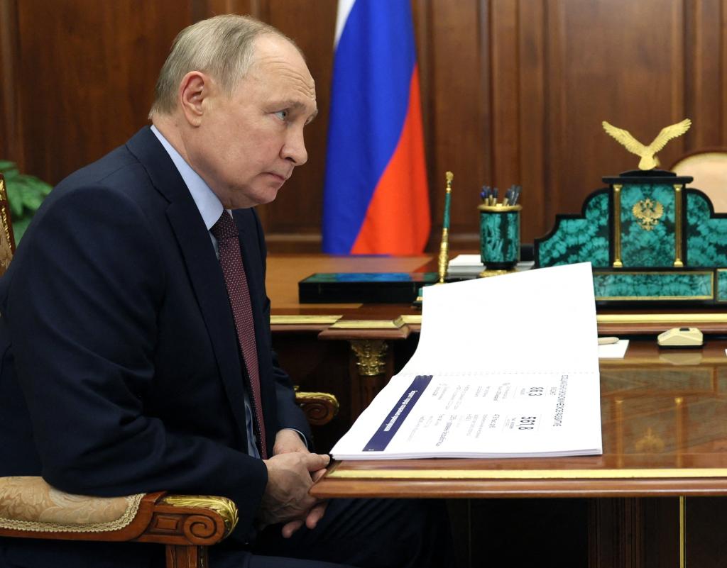 Russia's President Vladimir Putin meets with Mikhail Razvozhayev, the Russian-installed governor of Sevastopol - Crimea's largest city, at the Kremlin in Moscow on February 19, 2024