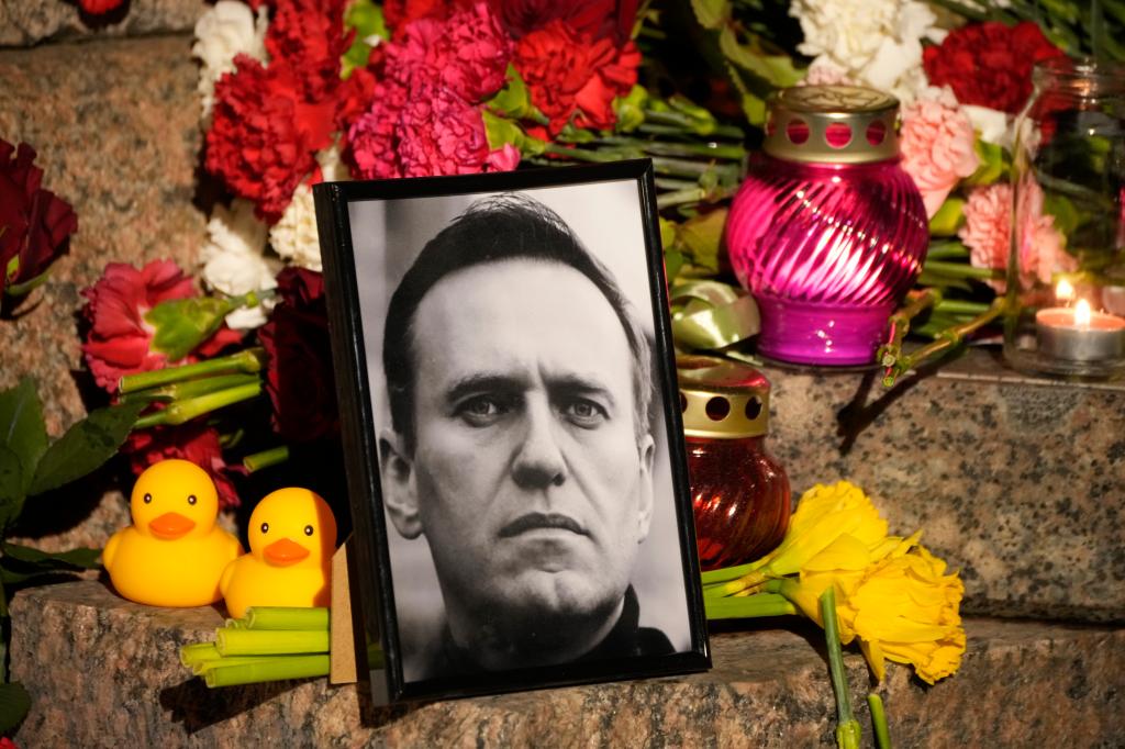 A portrait of Russian opposition leader Alexei Navalny is surrounded by flowers at the Memorial to Victims of Political Repression in St. Petersburg, Russia on Feb. 16, 2024.