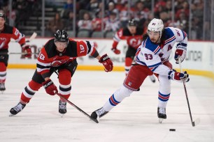 Rangers center Mika Zibanejad (93) is pursued by New Jersey Devils left wing Ondrej Palat