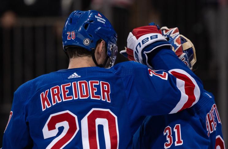 Chris Kreider #20 and Igor Shesterkin #31 of the New York Rangers.