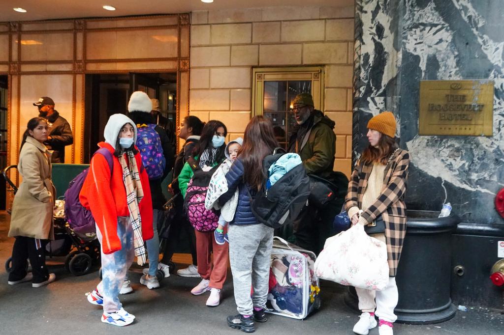 Migrants awaiting to enter the Roosevelt Hotel.