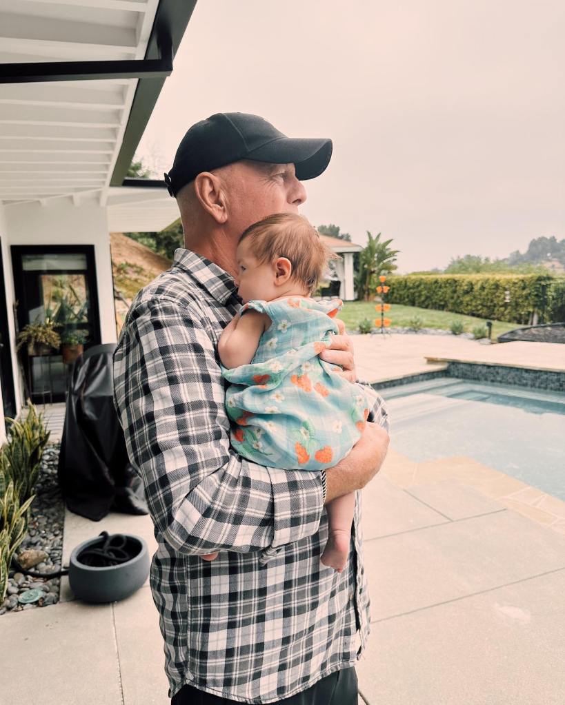 Bruce Willis holding his granddaughter, Rumer's daughter. 