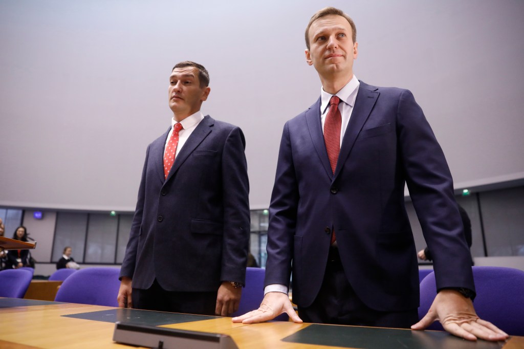 Russian opposition leader Alexei Navalny, right, and his brother Oleg stand during his hearing at the European Court of Human Rights in Strasbourg, eastern France, on Nov. 15, 2018