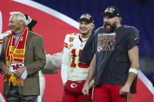 Travis Kelce #87 of the Kansas City Chiefs celebrates with Patrick Mahomes #15 after the AFC Championship.