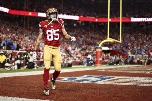 George Kittle #85 of the San Francisco 49ers walks to the bench after a touchdown during the NFC Championship NFL football game against the Detroit Lions.