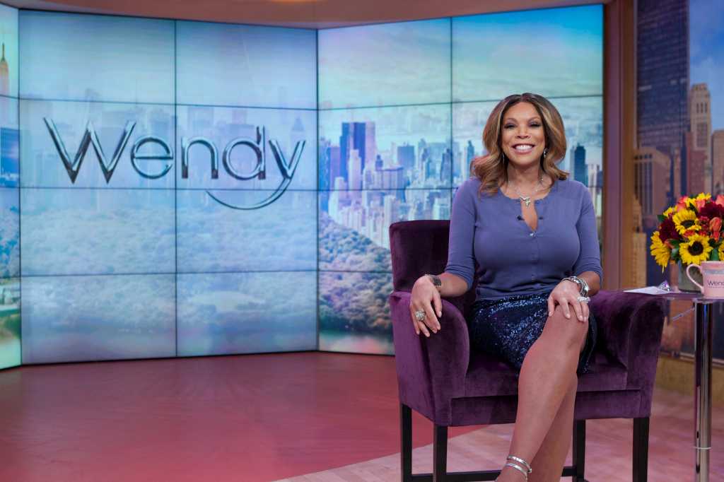 Wendy Williams smiling on her talk show. 