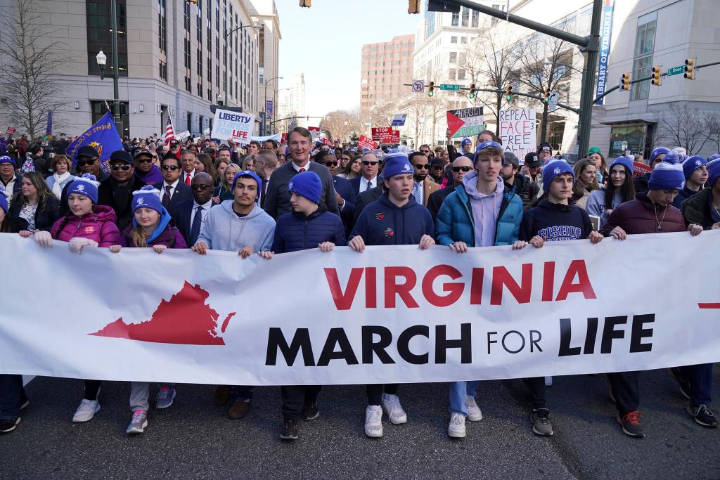 Virginia's Republican Gov. Glenn Youngkin, top center, walks with demonstrators during an anti-abortion demonstration on Feb. 21, 2024, in Richmond, Va.