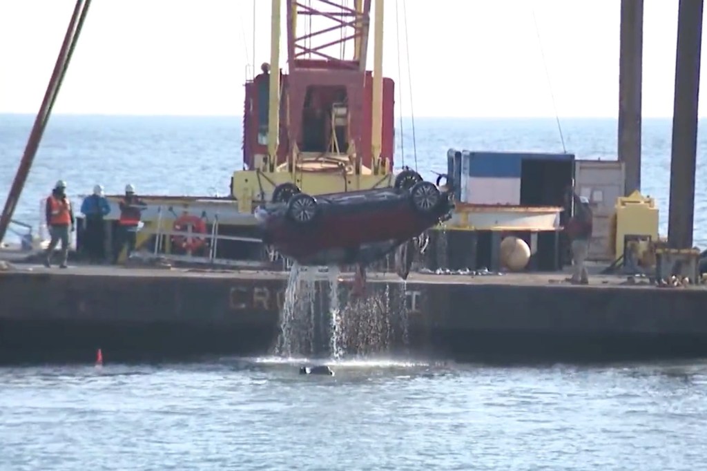 Crane pulling out SUV from Atlantic