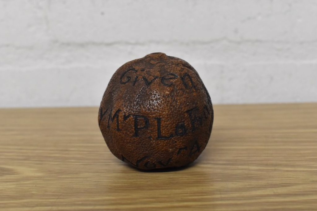 Brettells Auction House Facebook - a round orange with writing on it.
