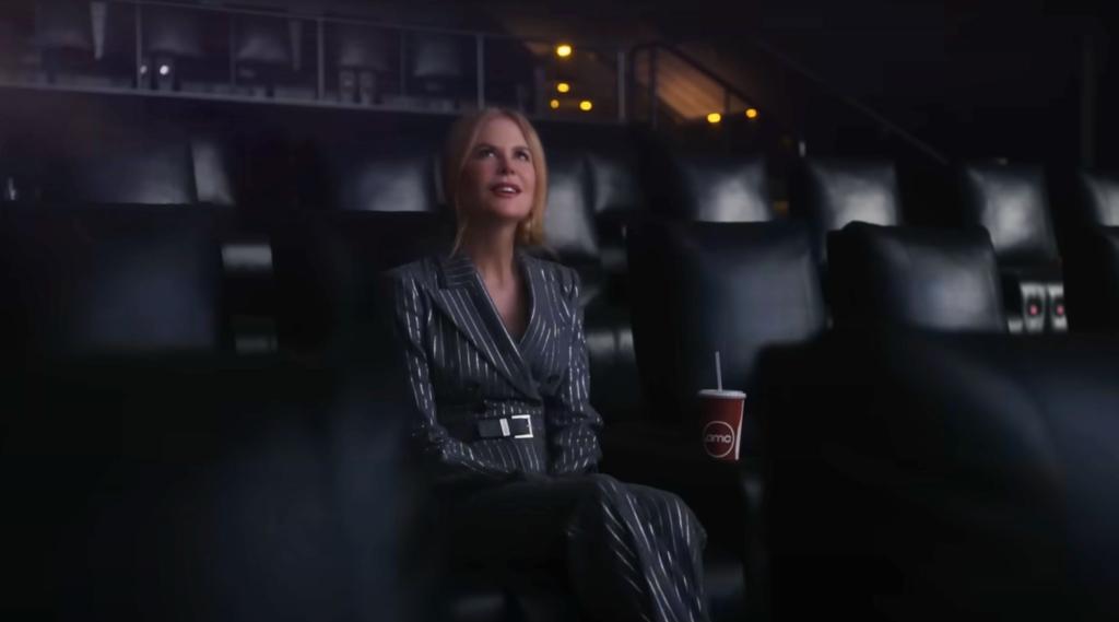 Nicole Kidman reacts to the movie clips she's watching, including "La-La Land," in the 2021 ad.