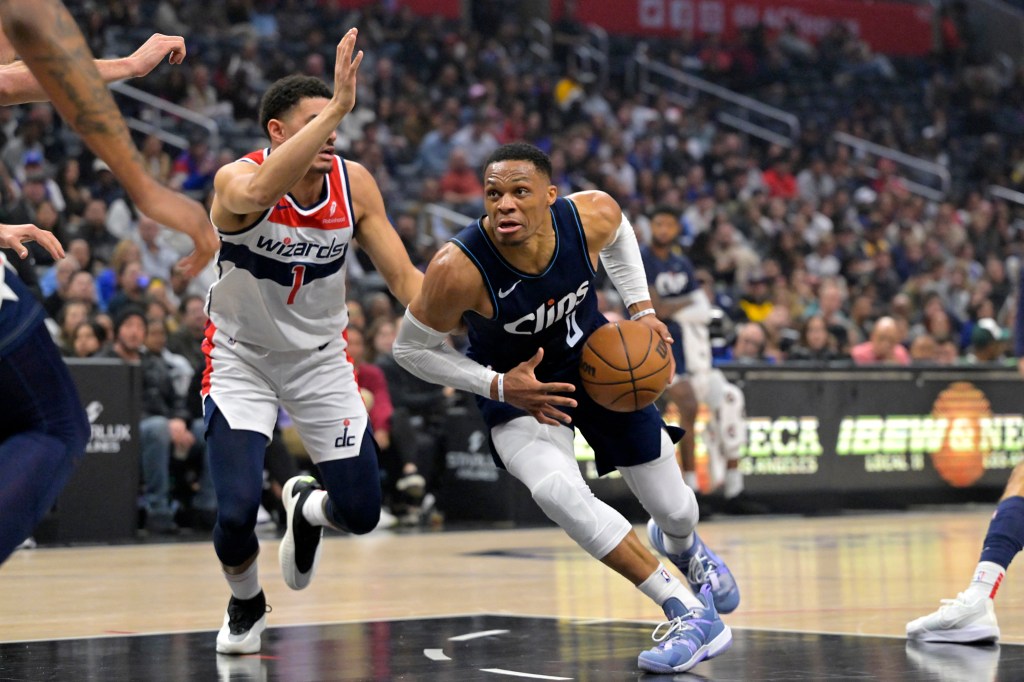 Clippers guard Russell Westbrook (0) drives past Washington Wizards guard Johnny Davis (1) in the first half at Crypto.com Arena. 