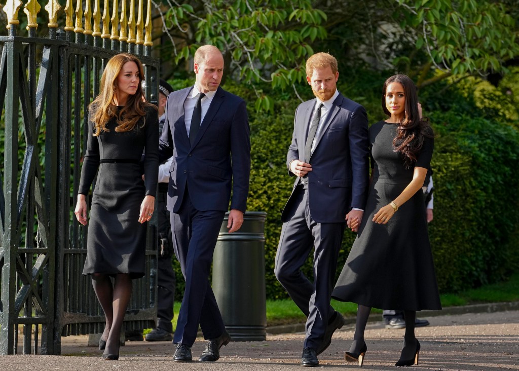 Prince William, Kate, Prince Harry, and Meghan view floral tributes for the late Queen Elizabeth II outside Windsor Castle.