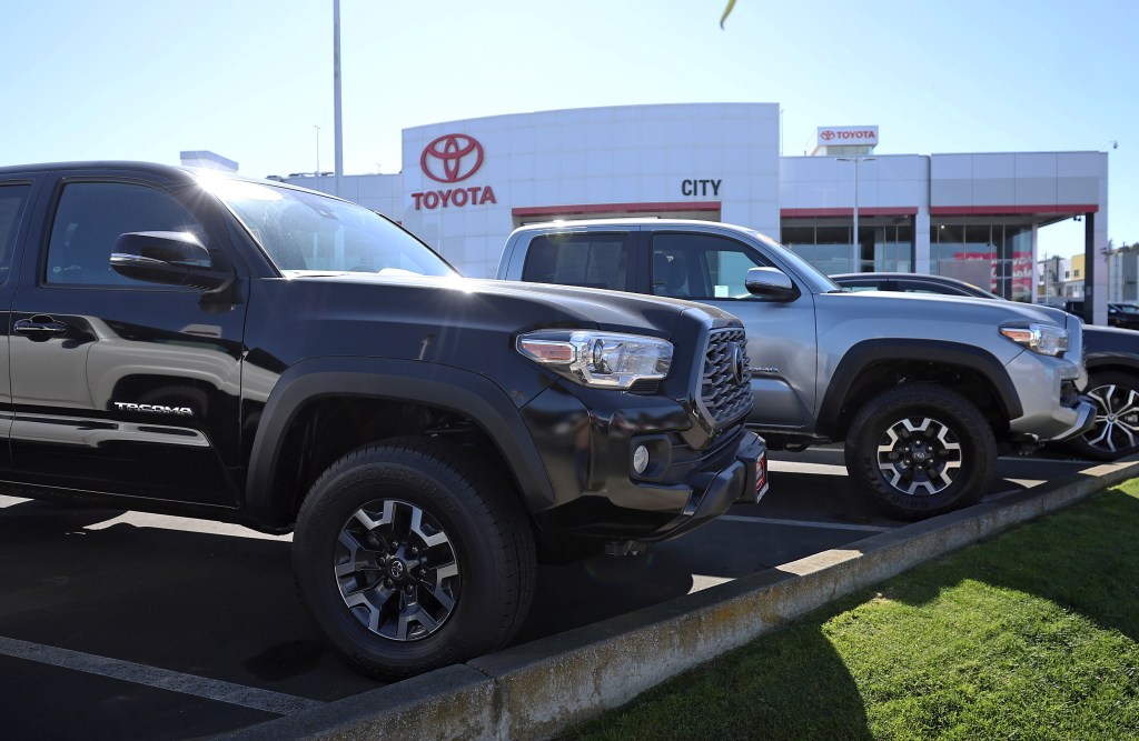 Toyota Tacoma trucks displayed on sales lot in Daly City, California
