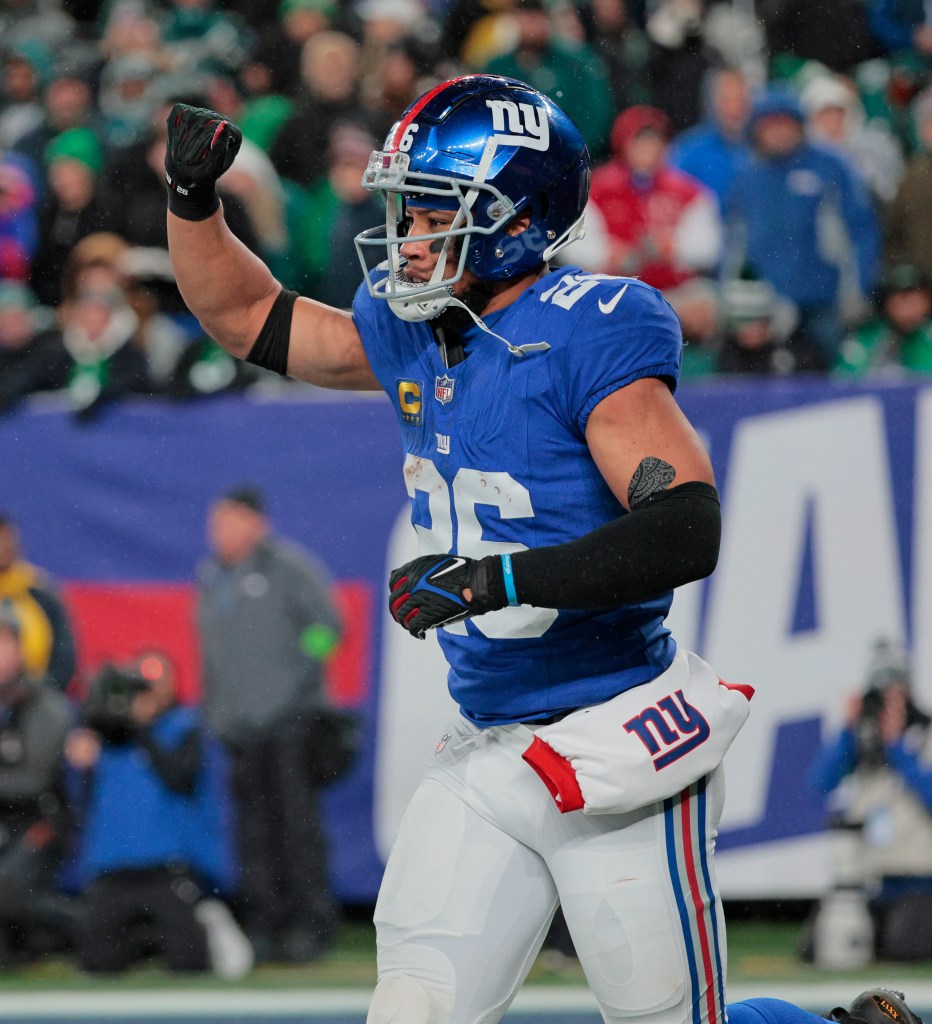 New York Giants running back Saquon Barkley #26 reacts after he scores a touchdown during the second quarter.