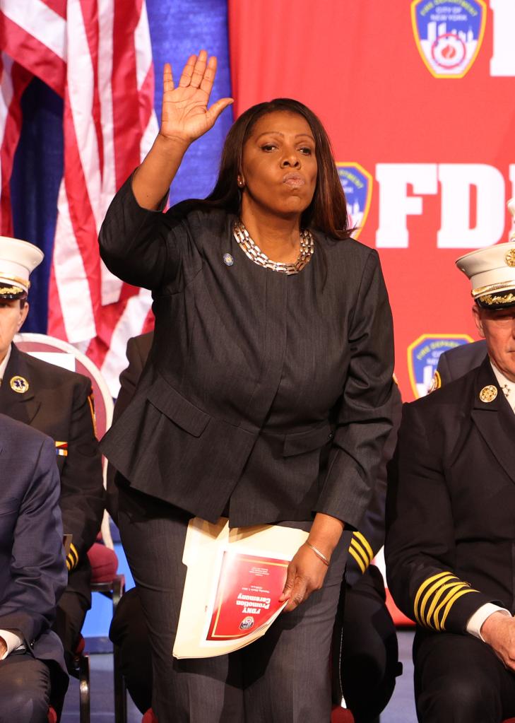 Attorney General Letitia James salutes with uniformed individuals, including FDNY Chief of Department John Hodgens and Fire Commissioner Laura Kavanagh.