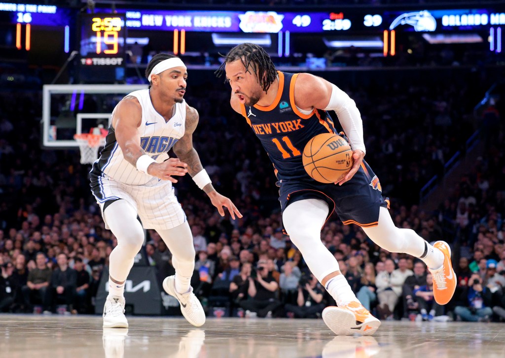 Jalen Brunson #11 of the New York Knicks drives past Gary Harris