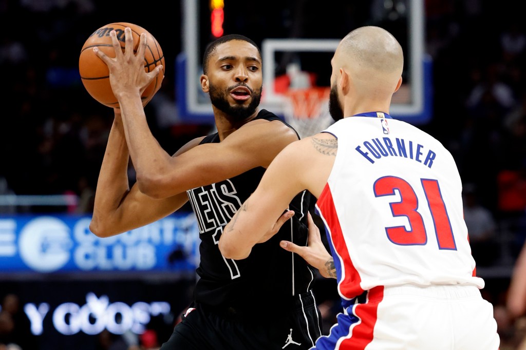 Nets forward Mikal Bridges (1) is defended by Detroit Pistons guard Evan Fournier (31) in the second half at Little Caesars Arena. 