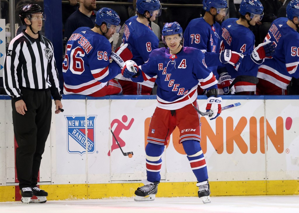 Rangers left wing Artemi Panarin (10) is greeted by his teammates on the bench after he scores a goal during the second period when the New York Rangers played the Columbus Blue Jackets