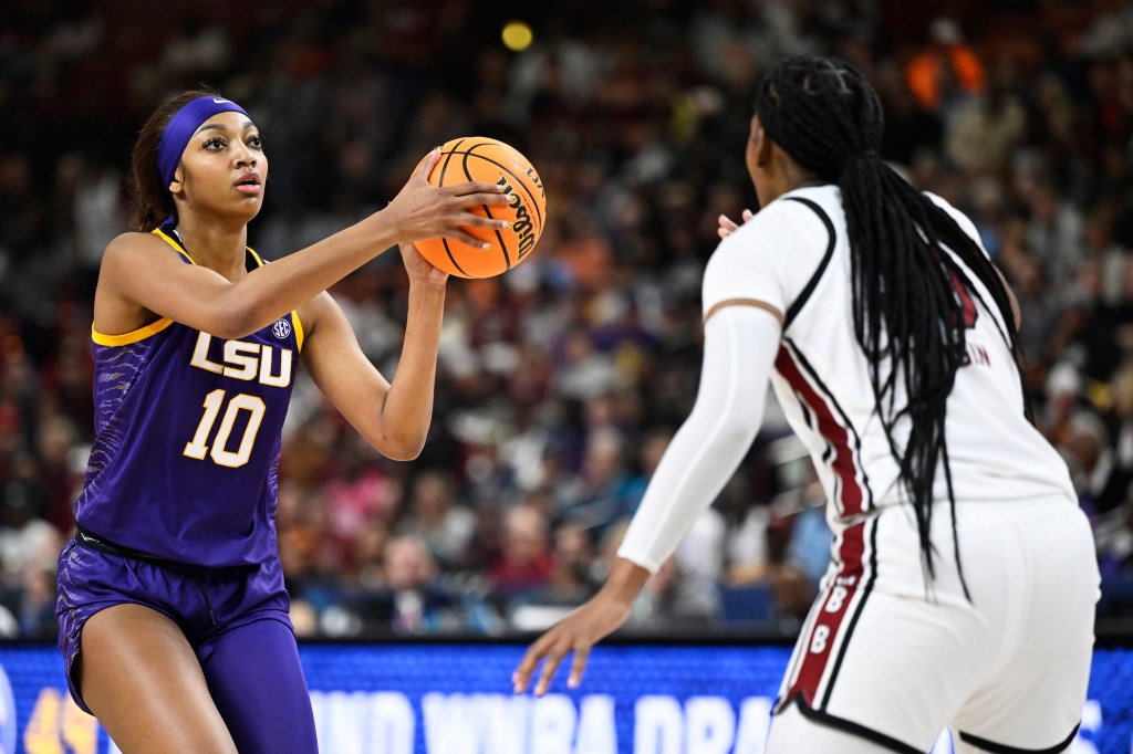 Angel Reese #10 of the LSU Lady Tigers shoots a basket against Sania Feagin #20 of the South Carolina Gamecocks in the second quarter during the championship game of the SEC Women's Basketball Tournament at Bon Secours Wellness Arena on March 10, 2024 in Greenville, South Carolina.  